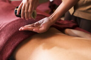 Hand,Pouring,Oil,For,Massage,In,Spa